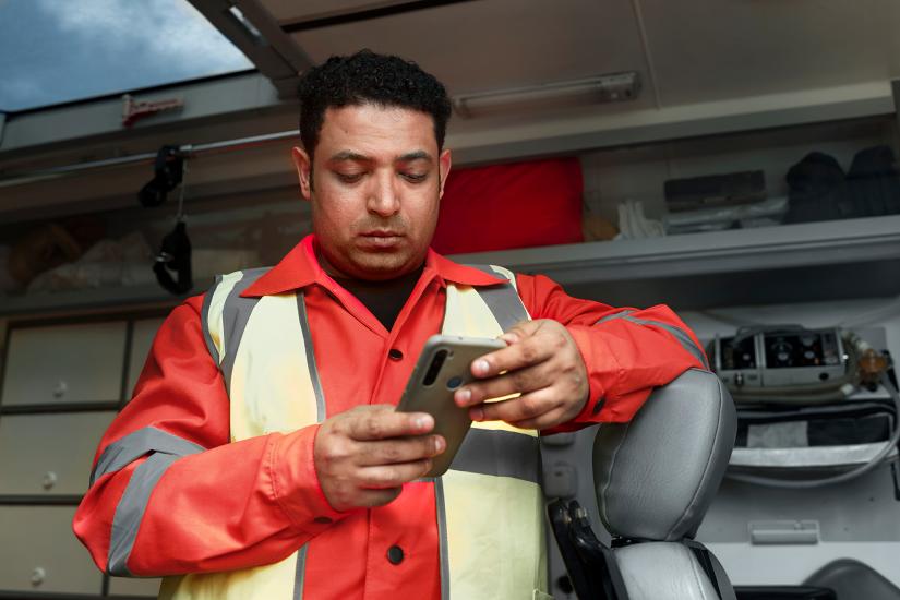 Worker looking down at his phone